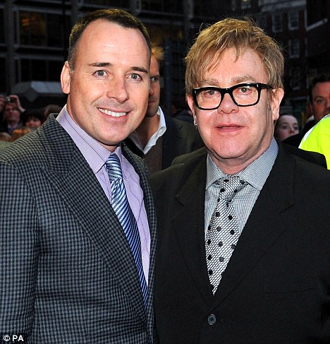 Staff: Sir Elton John (right) and partner David Furnish had 22 members of their entourage last year - up from just 14 in 2008